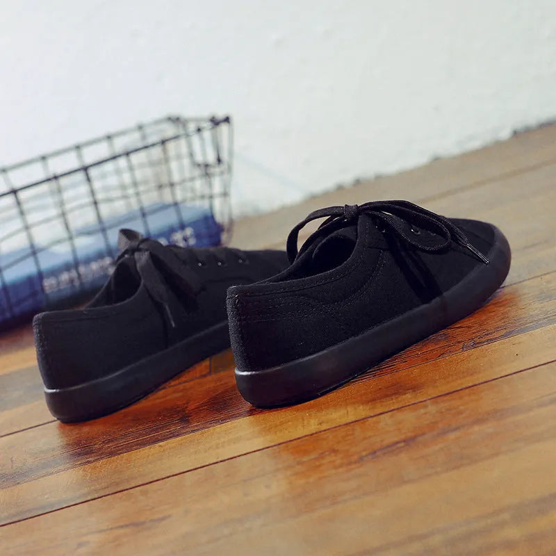 Korean style all black women's flat canvas work shoes with lace-up front