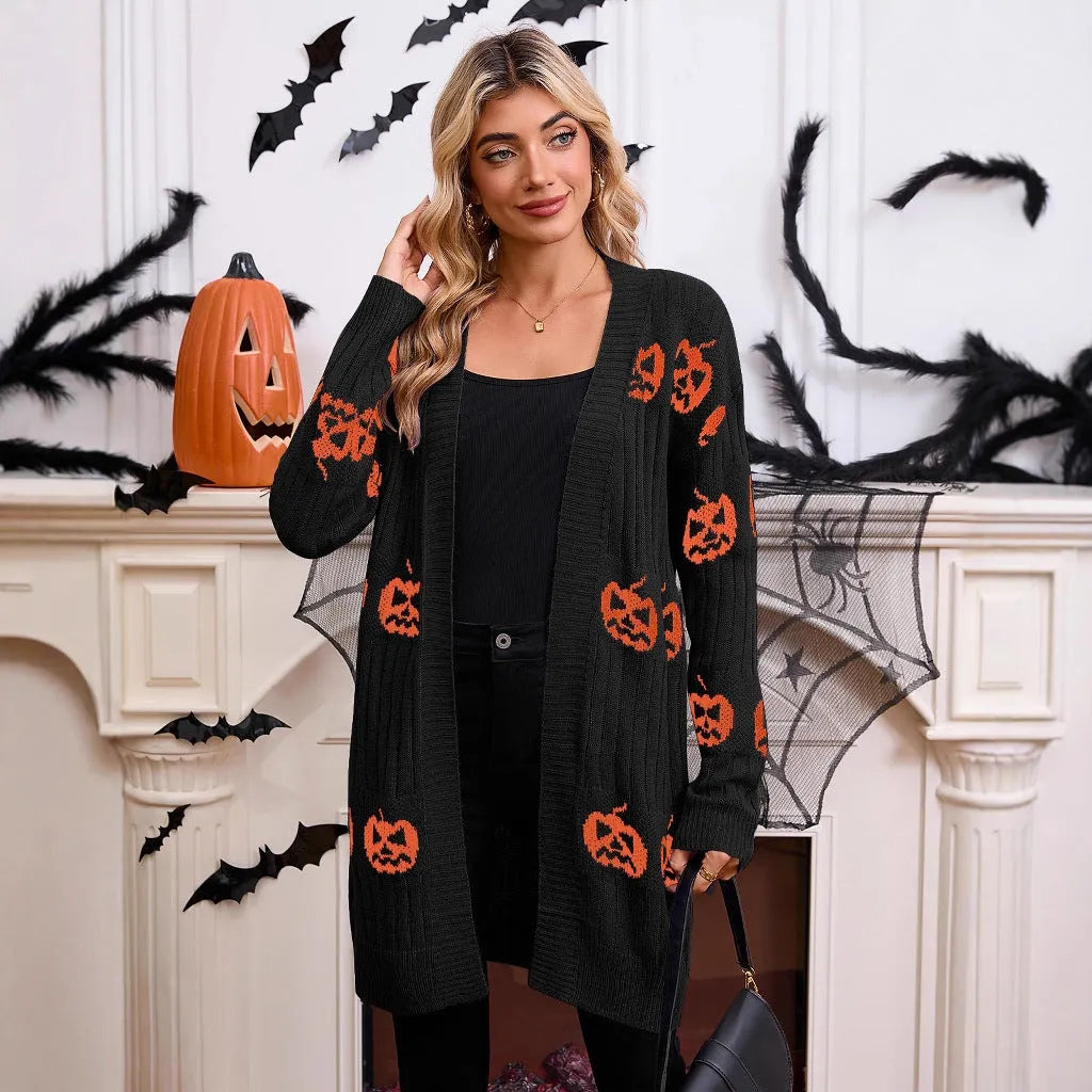 Women's black Halloween cardigan with orange pumpkin head jacquard knitting.