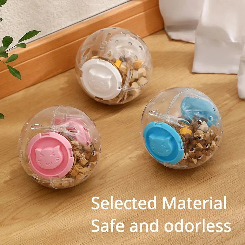 Clear blue slow feed ball for dogs and cats with small openings for treat dispensing