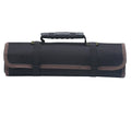 Brown Oxford cloth electrician storage bag reel mounted on wall with tools inside