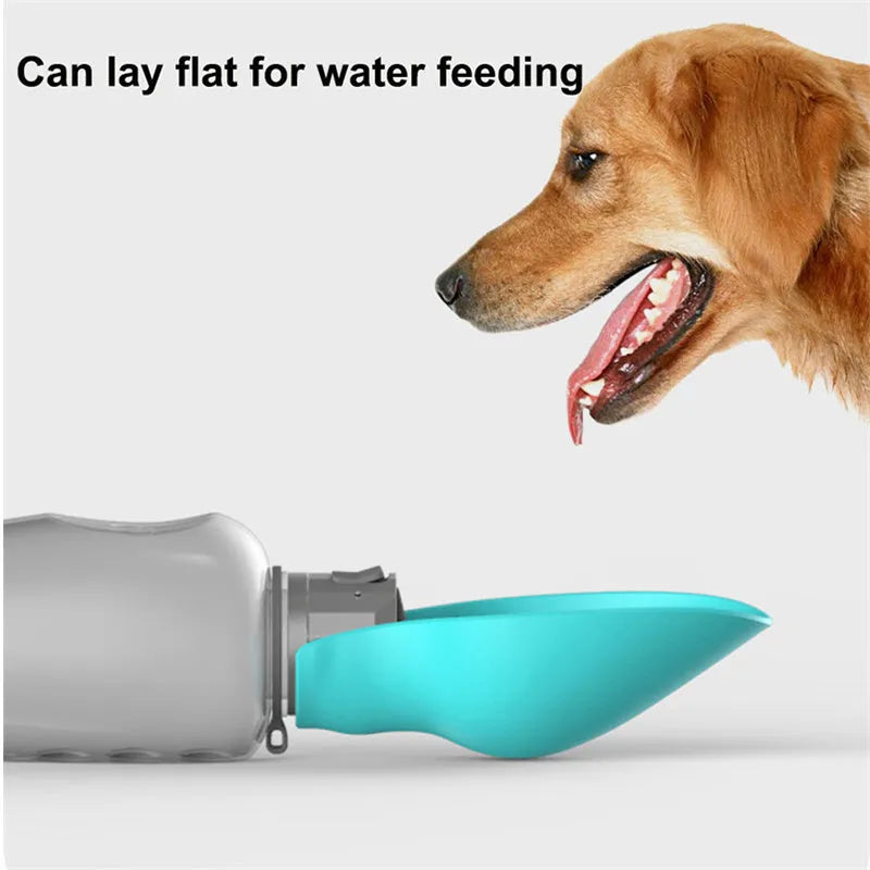 Blue-grey foldable dog water bottle with drinking trough open, showing wrist strap and lock key.