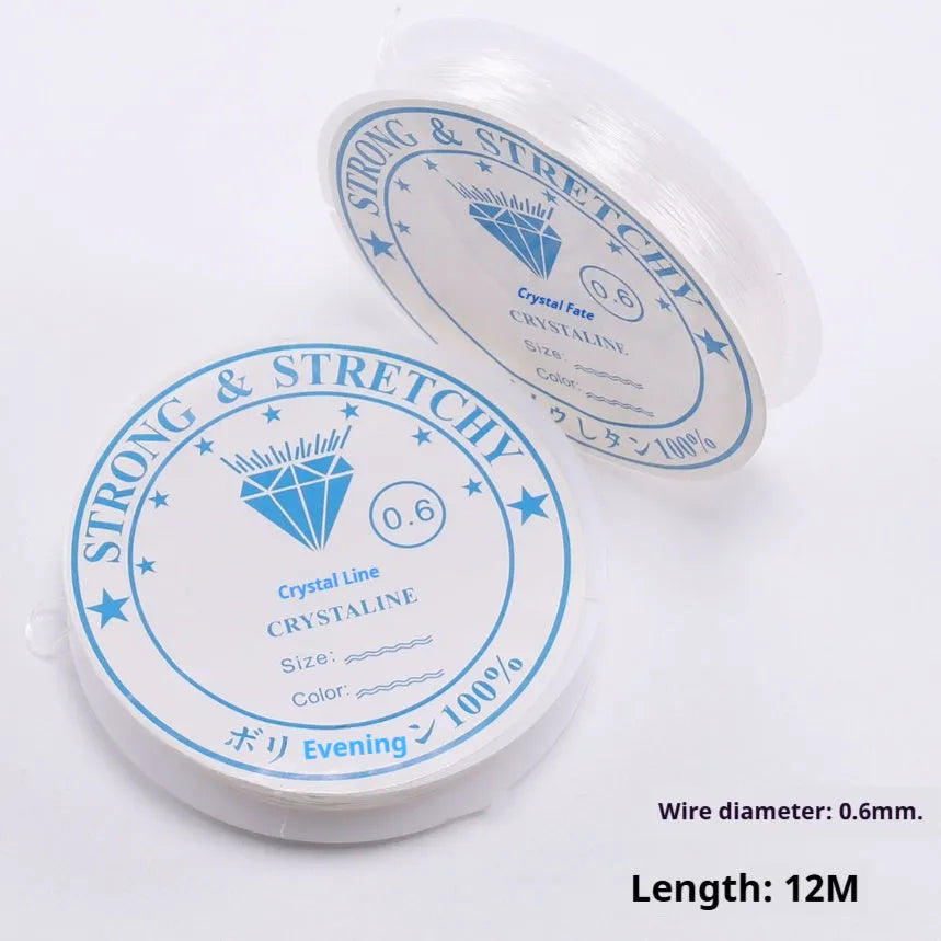 Spool of transparent white elastic fishing line for DIY crafting and jewellery making.