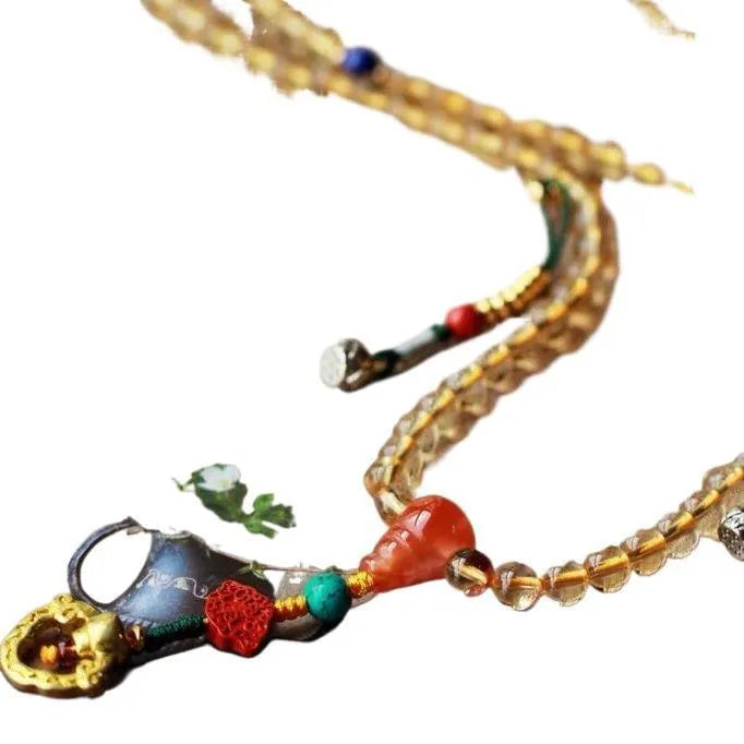 Brazilian citrine bracelet with red and yellow colours on adjustable filament cord