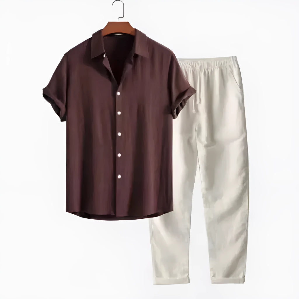 Man wearing grey blue loose short sleeve shirt and matching trousers from casual suit set