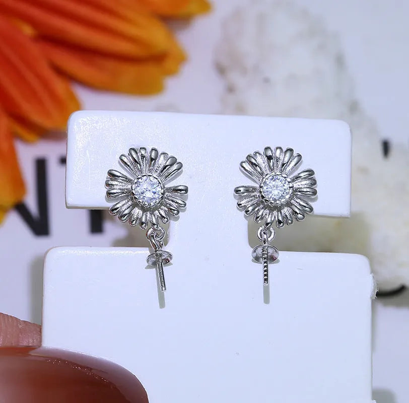 Baroque flower-shaped S925 sterling silver earring frames and a ring holder on a plain background.