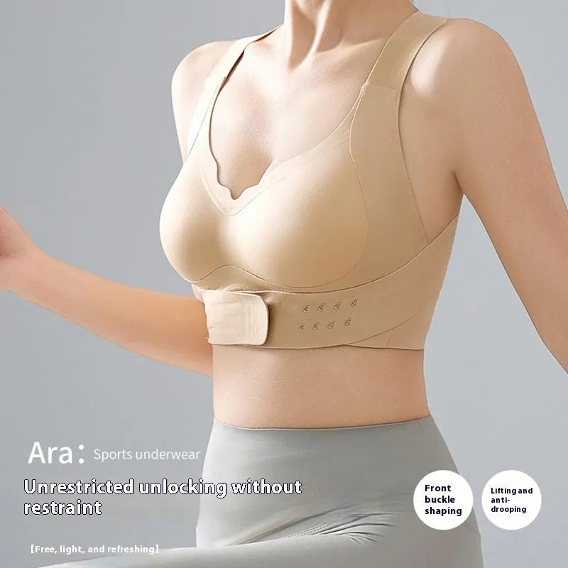 Women's front buckle cross back yoga sports bra in black, white, and nude colours