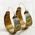 Gold-coloured geometric women's earrings with hollow pattern design and petal-inspired elements