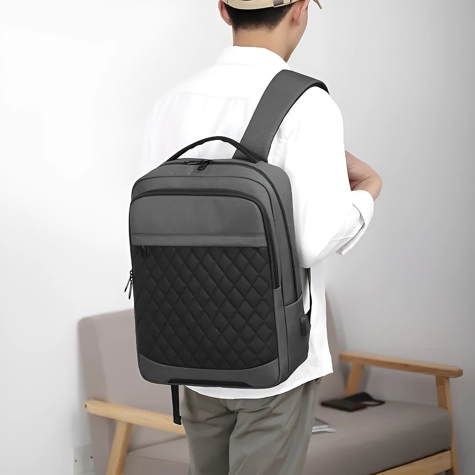 Men's Oxford cloth backpack in black, blue, or grey with curved straps and diamond mesh panels