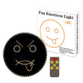 Black car rear window LED expression light showing orange smiley face design with remote control