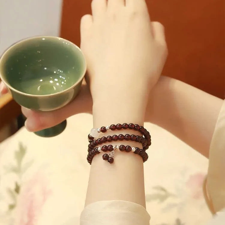 Chinese-style garnet bracelet with U-shaped design and pomegranate elements in antique style