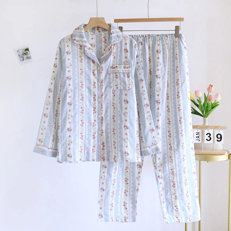 Women's cotton gauze pyjama set with long sleeves and trousers in stripe and red fruit patterns.