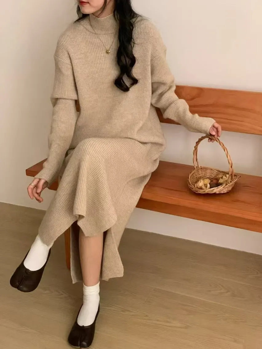 Woman wearing a milky white half turtleneck acrylic knit dress with a high waist and overknee A-line skirt.