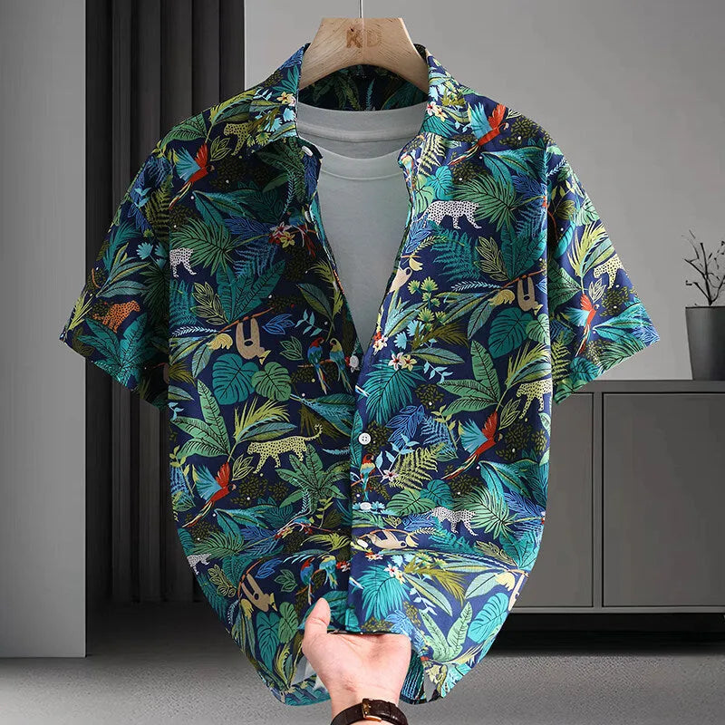 Man wearing a short sleeve Hawaiian style casual shirt with a floral printed pattern.
