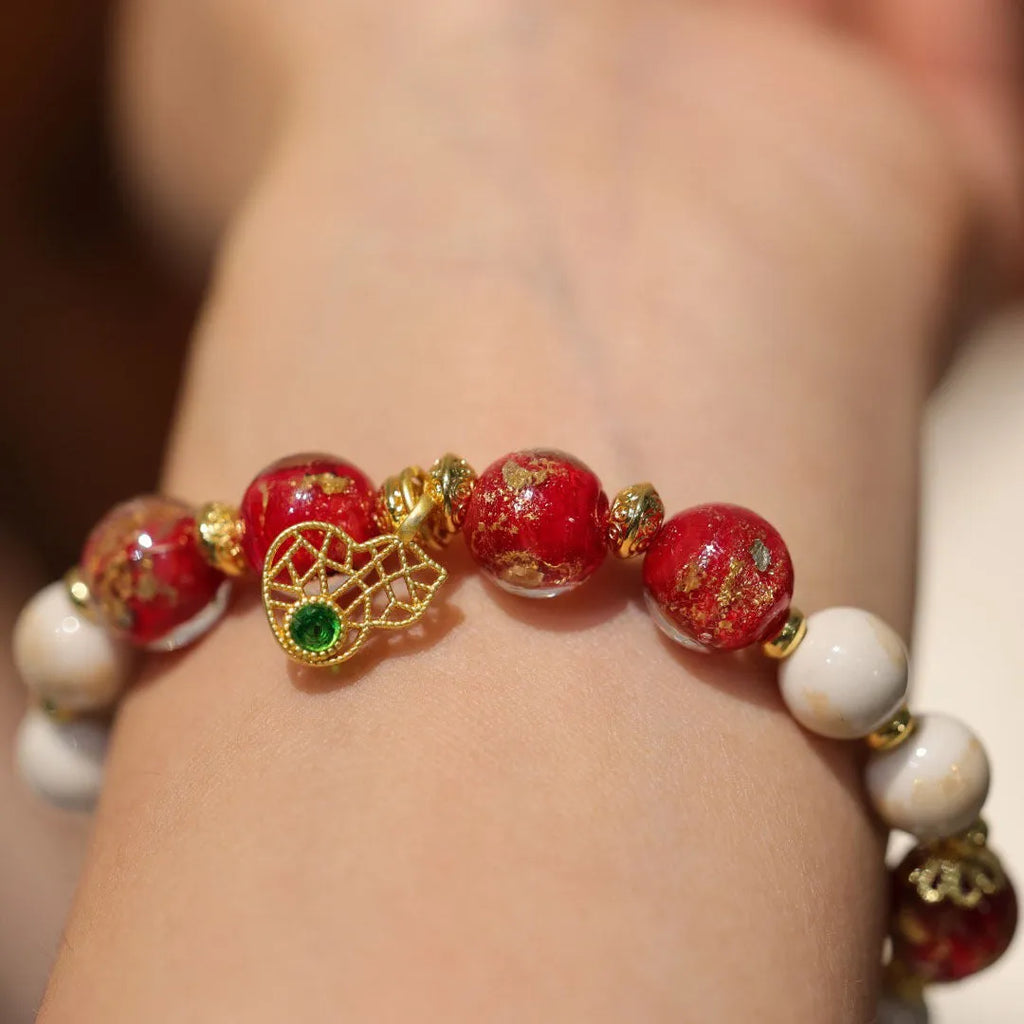 Close-up of a manually crafted gold foil coloured glaze ethnic bracelet for women, showing geometric design.
