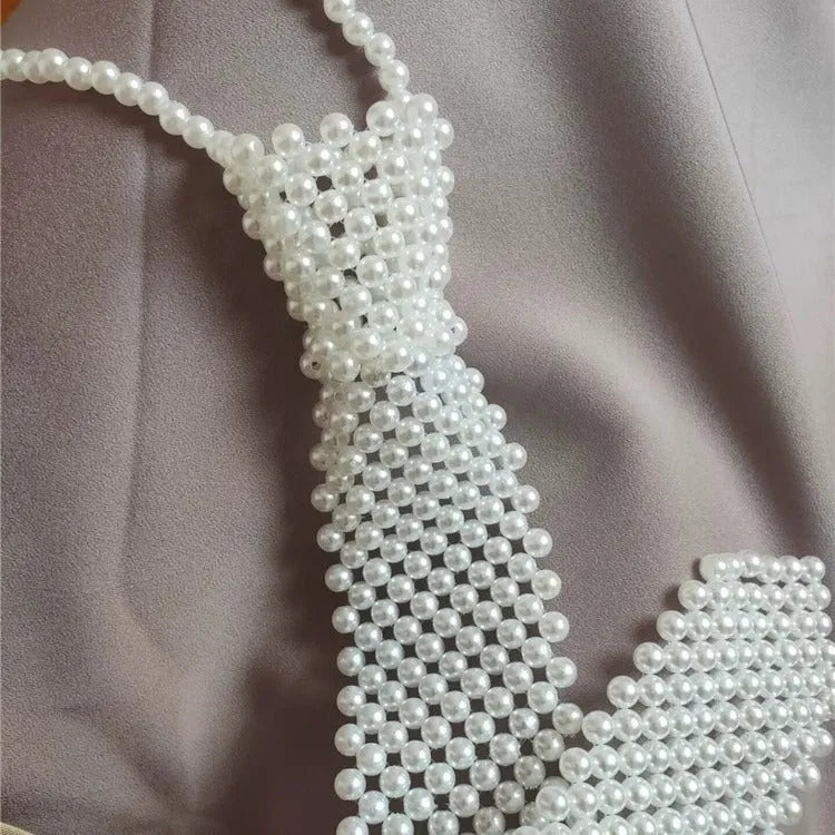 Retro hollow out imitation pearl body chain with alloy tie fastening in black colour