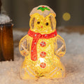 Glowing plastic gingerbread snowman Christmas ornament with a red scarf