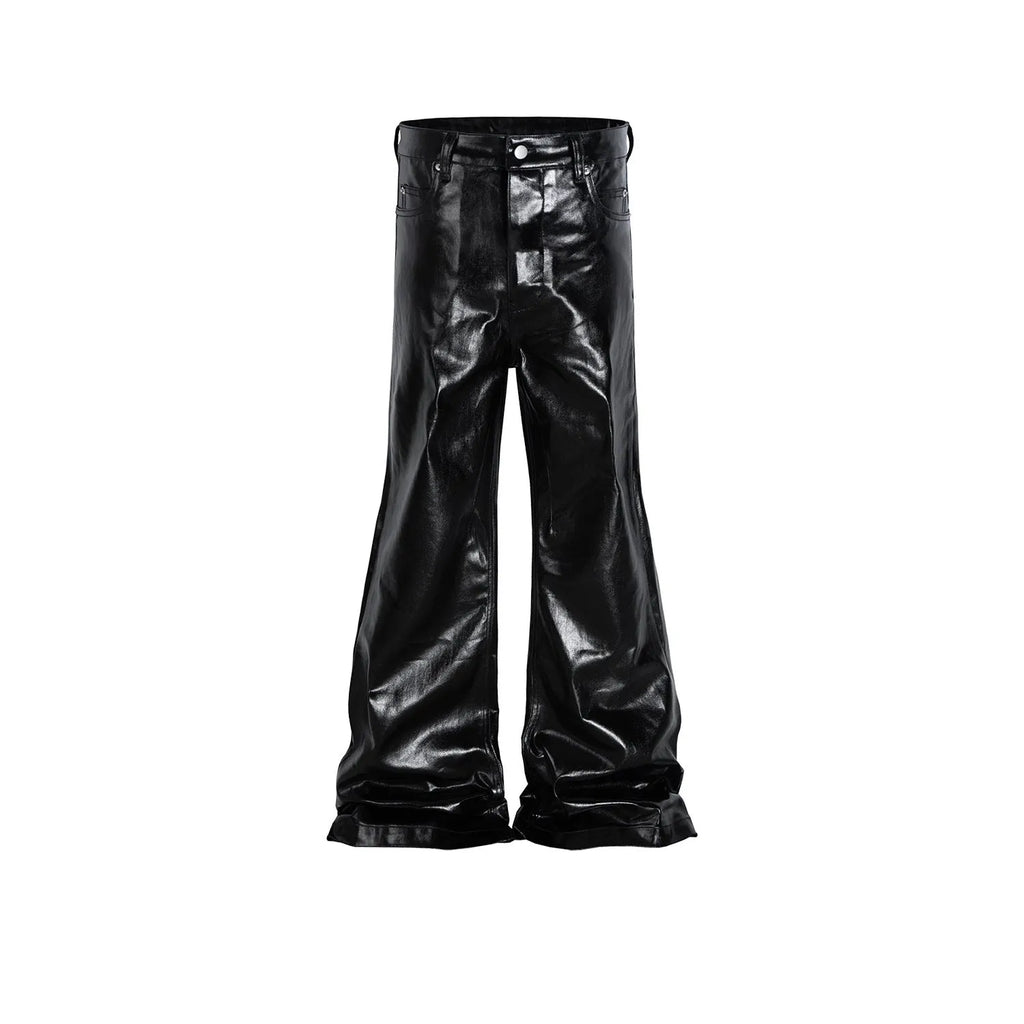 Black coated patent leather skinny jeans with a straight leg and mid-waist fit on a model.