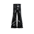 Black coated patent leather skinny jeans with a straight leg and mid-waist fit on a model.