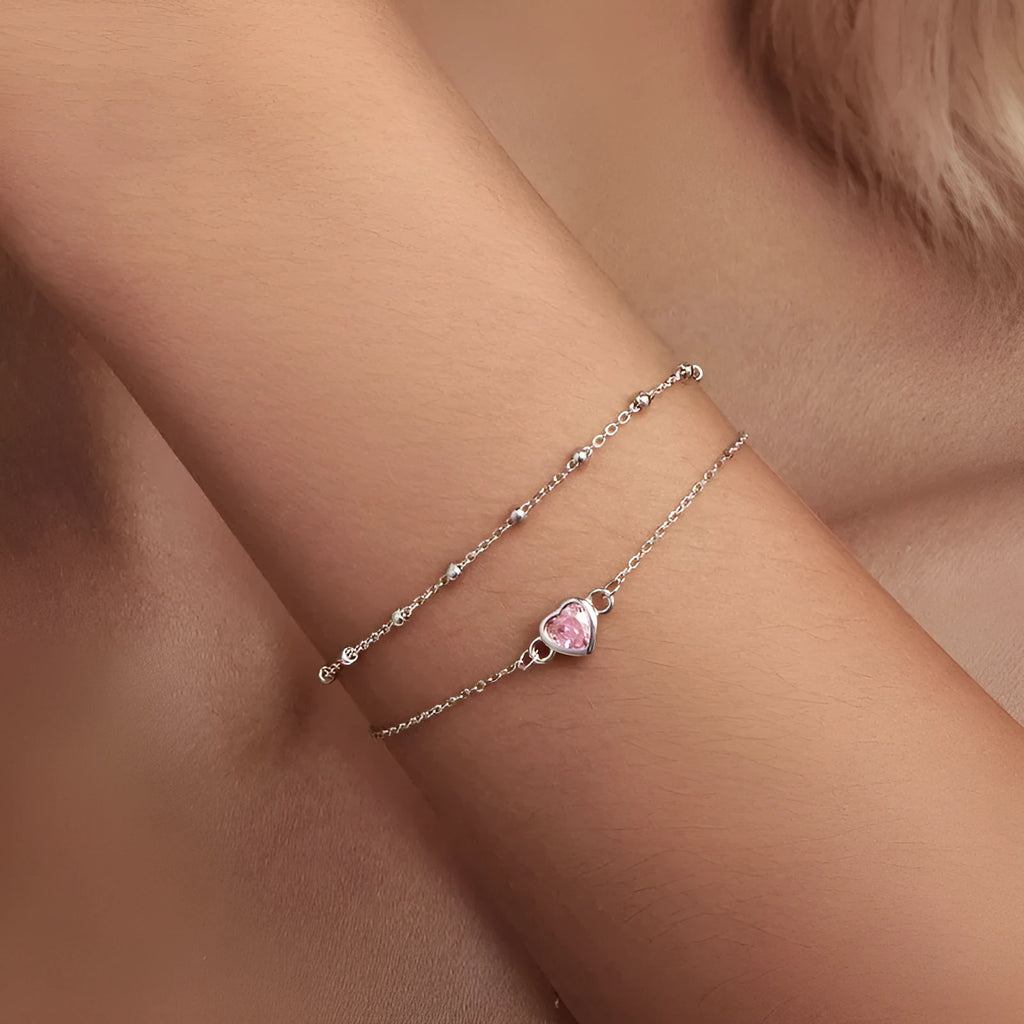 Women's sweet style 925 sterling silver bracelet with small heart charm on an adjustable chain.