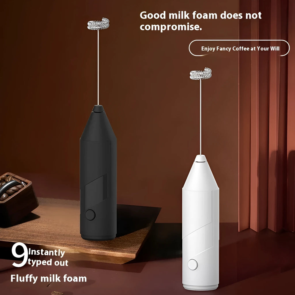 Mini handheld electric milk frother in black, white, or khaki with stainless steel whisk and USB charging port.