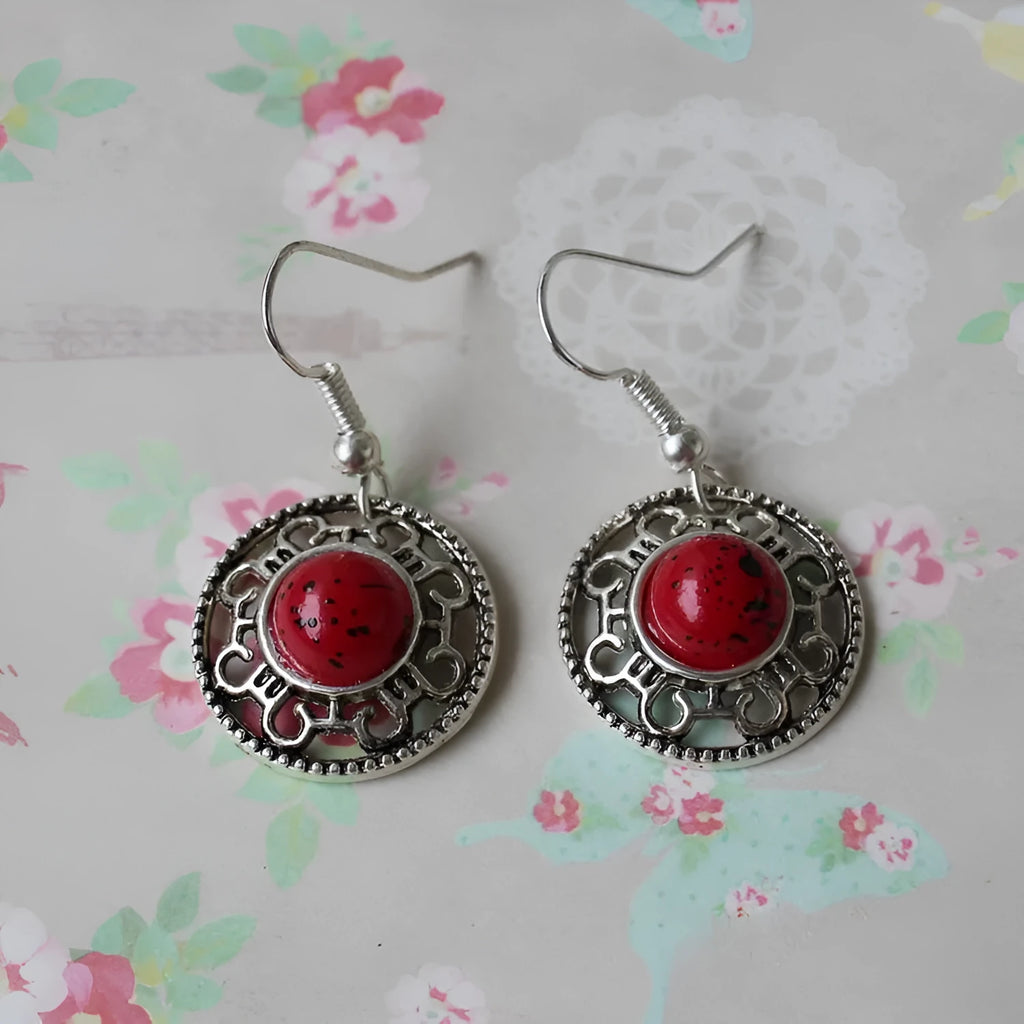 Handmade geometric flower disk earrings made of Tibetan silver and turquoise with ethnic patterns.