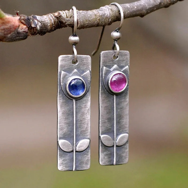 Antique finish red sapphire geometric earrings with ellipse elements and electroplated metal construction