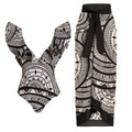 Women's deep V-neck one-piece swimsuit with vintage floral print and matching black wrap skirt.
