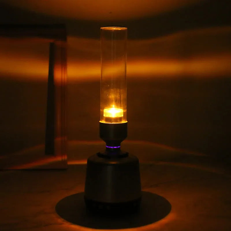 White silver modern candlelight Bluetooth speaker and night light on a surface, showing its upright 90x277mm design.