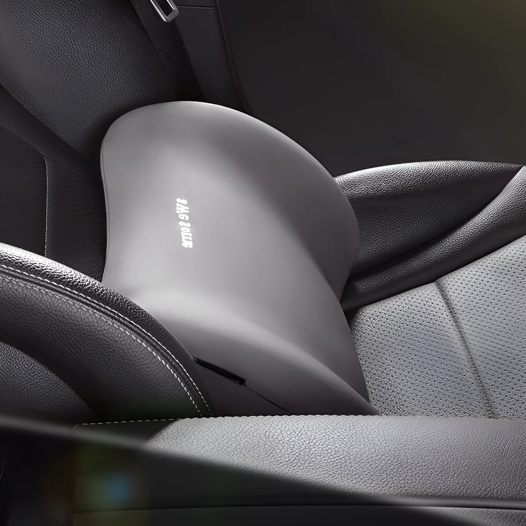 Cow head style black car headrest pillow and matching lumbar support pillow set on a car seat.
