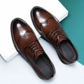 Men's black and brown brogue leather shoes with traditional perforated detailing for business wear