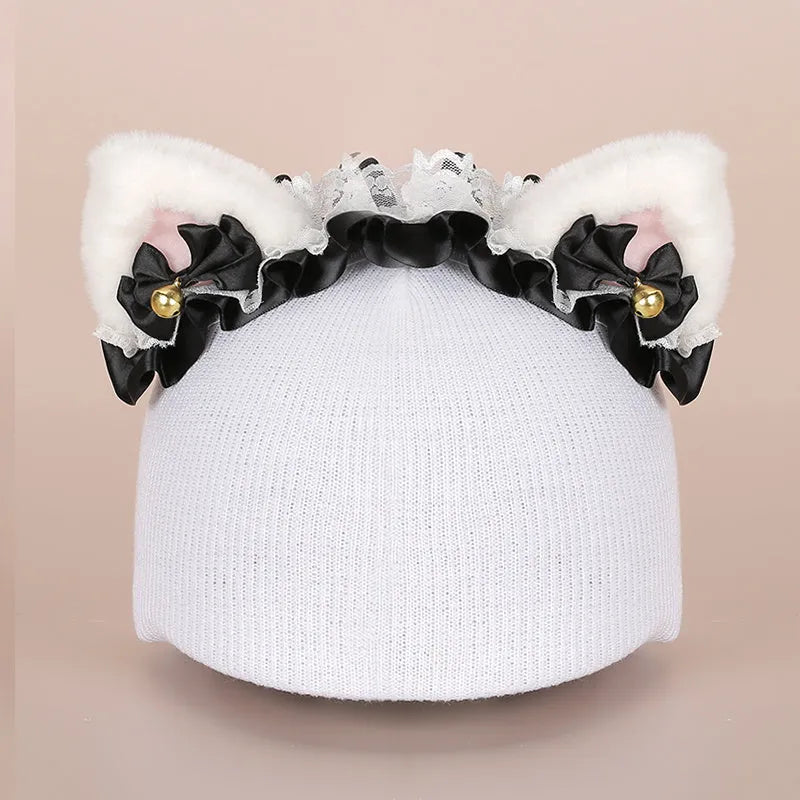 Soft plush cartoon helmet decoration sitting on top of a black ski boot.