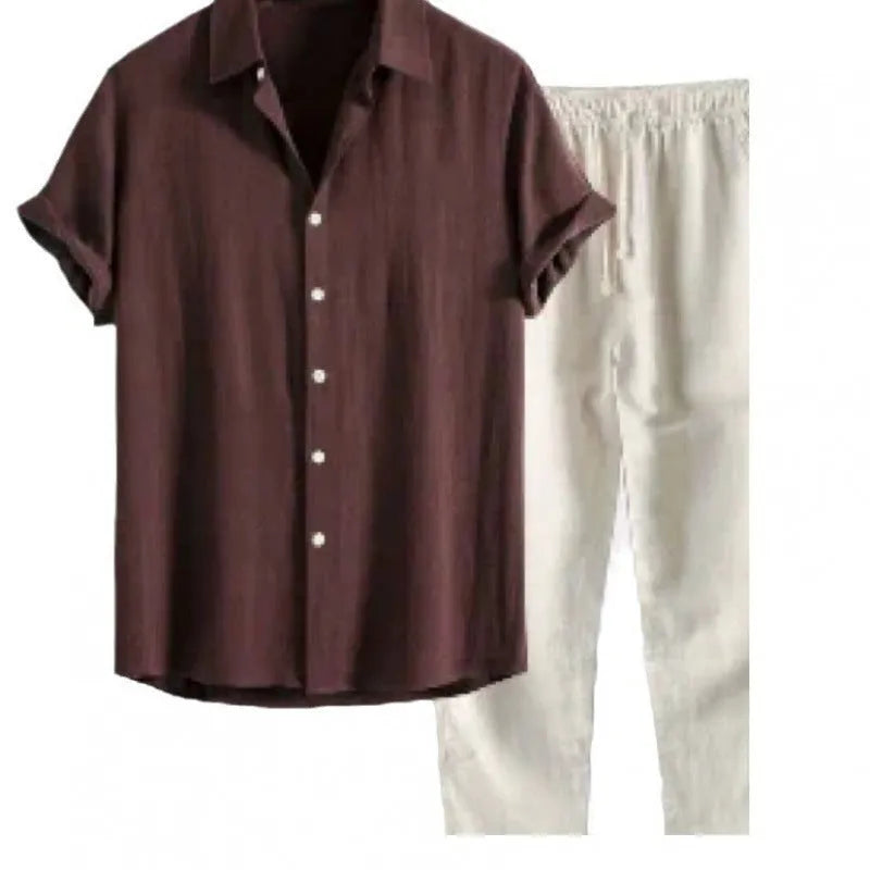 Man wearing grey blue loose short sleeve shirt and matching trousers from casual suit set