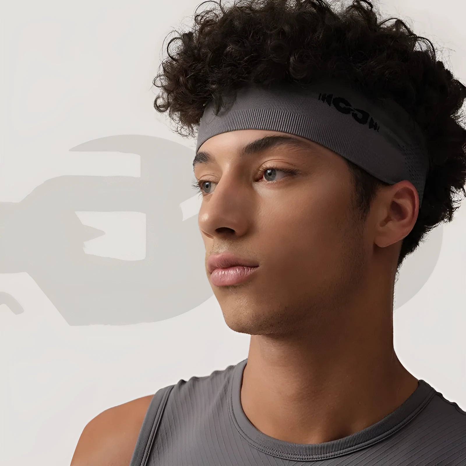 Seamless knitted exercise hair band in black, grey, or blue for running and cycling.