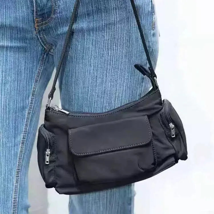Black PU women's shoulder bag with double pockets and side line detail.