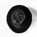 Handmade wool felt skull hat with a conical crown, shown in the colour Skull Hat.