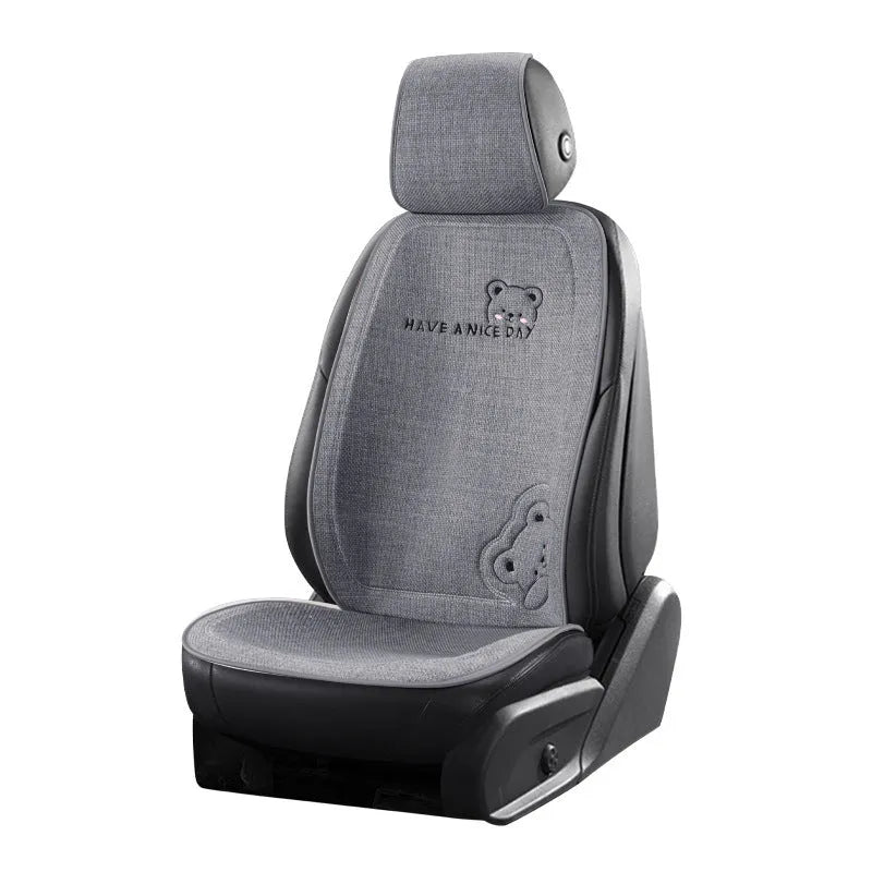 Cure Bear linen car seat cushion set showing lumbar support pillow and headrest in a choice of colours.