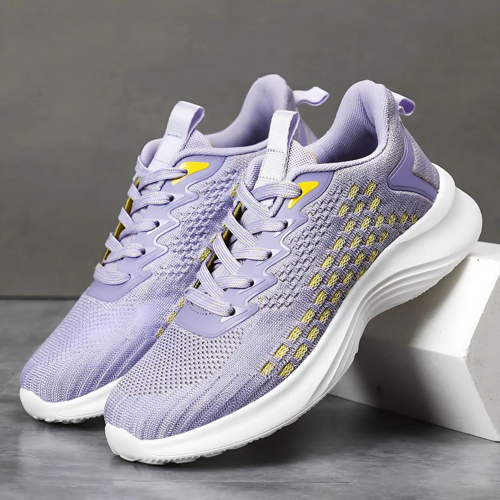 Women's lavender purple running shoes with mesh upper and EVA sole for sports.