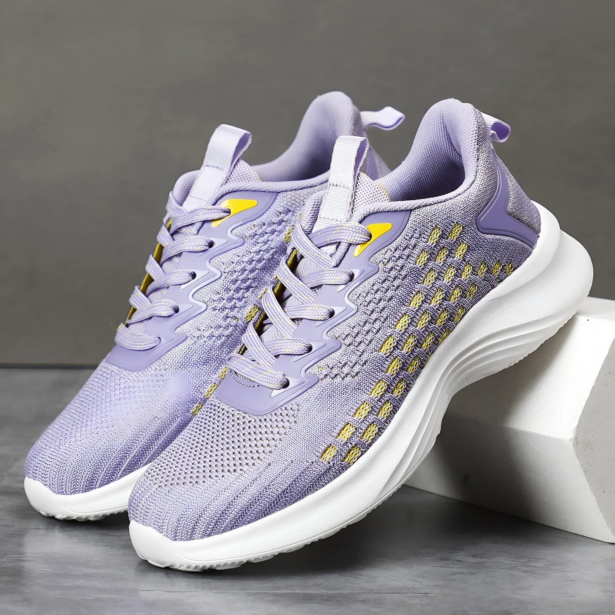 Women's lavender purple running shoes with mesh upper and EVA sole for sports.