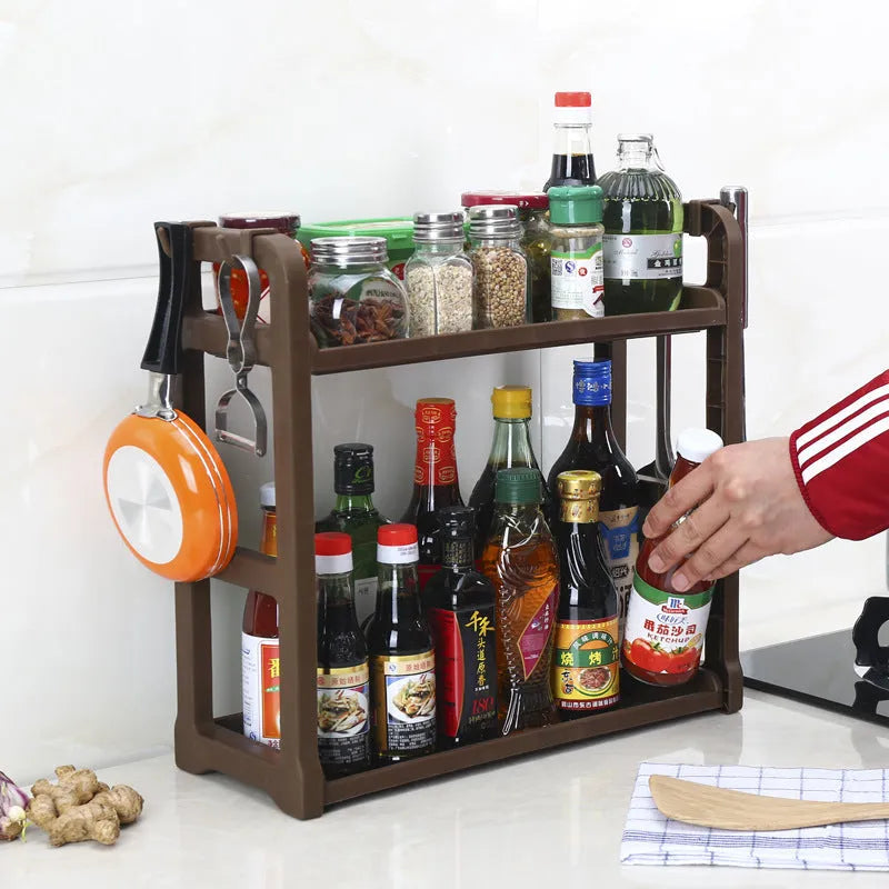 Foldable kitchen storage rack with multi-layer white shelving for organised kitchen supplies