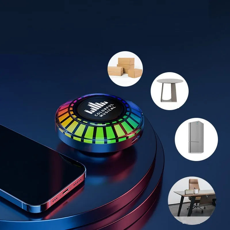 Small black cube voice control polar light Bluetooth LED atmosphere lamp on a table.