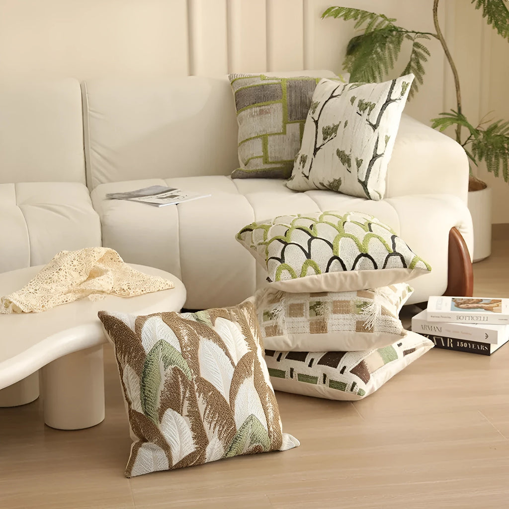 Square 45cm retro jacquard cushion cover with a woven plants and flowers pattern in a Nordic style, shown in one of eight available colours.