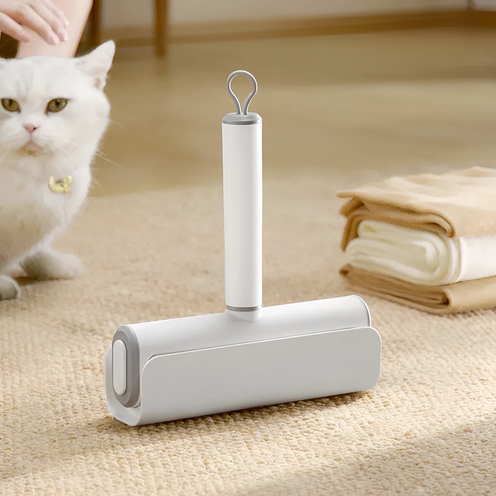 Pet lint remover roller tool with tearable paper sheets for cat hair removal from floors