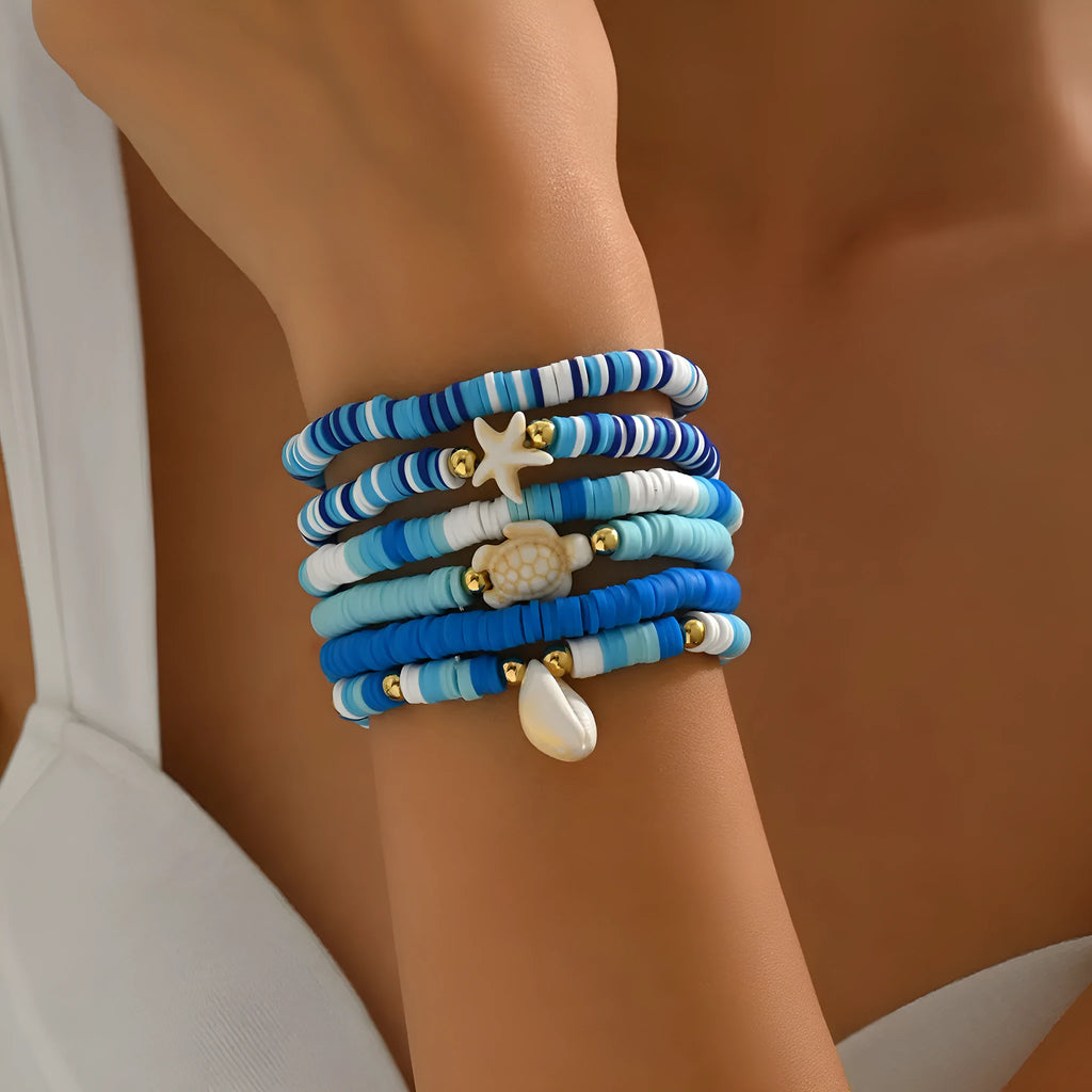 Six polymer clay handmade bracelets with Bohemian blue shells and geometric designs