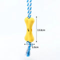Green porous bone-shaped rope dog toy with knotted texture for chewing and treat hiding