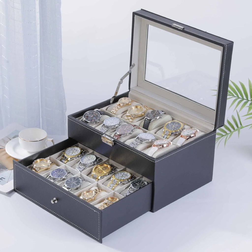 Grey leather watch storage box with transparent dustproof lid showing multiple watch slots inside