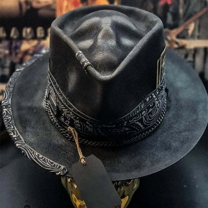 Handmade wool felt skull hat with a conical crown, shown in the colour Skull Hat.