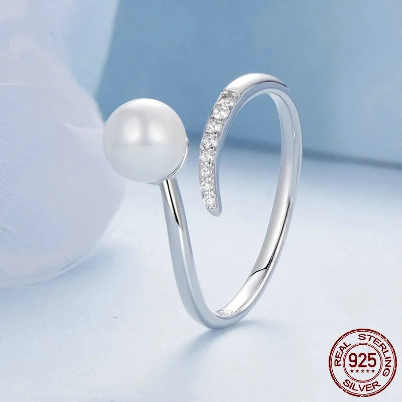 Adjustable S925 sterling silver ring with a pearl on an open-loop band.