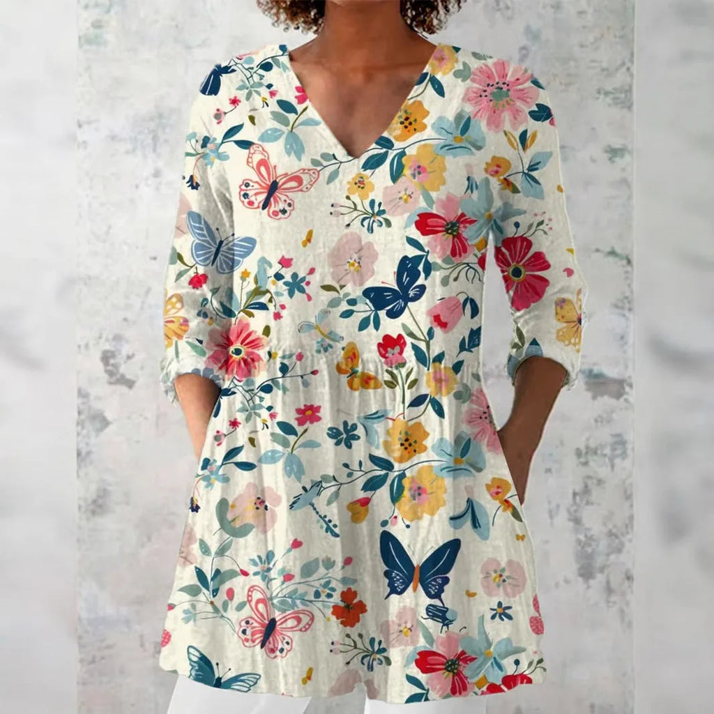 Women's slim fit long-sleeved top with a retro all-over digital print, shown in a selected colour.
