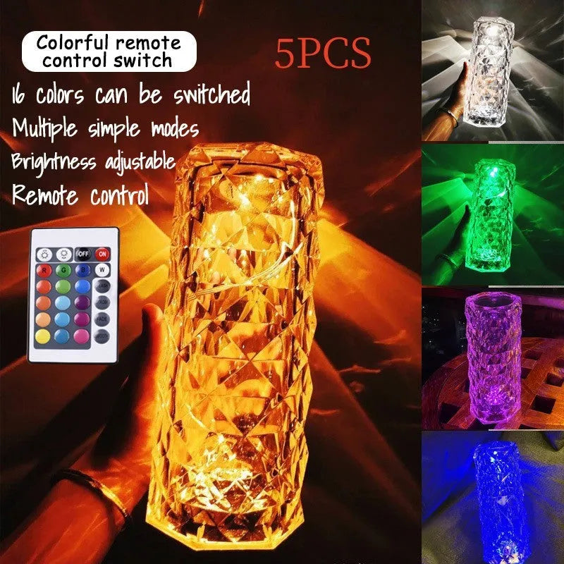 LED rose diamond shaped table lamp with acrylic construction and three-tone lighting on a wooden surface.