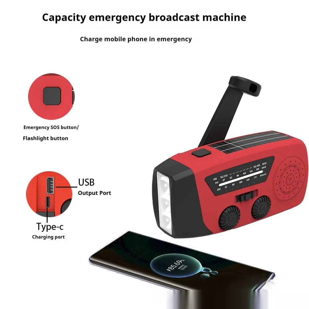 Red rechargeable emergency hand-crank radio with LED torch and USB port for disaster prevention